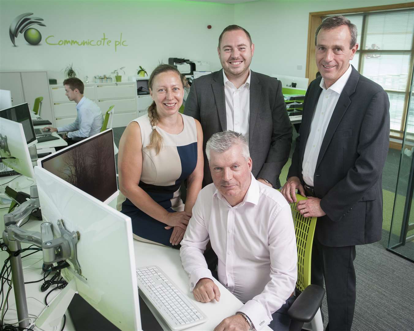 From left, Emily Bentley, Oliver Stell and John Toal with Communicate boss Tony Snaith, front