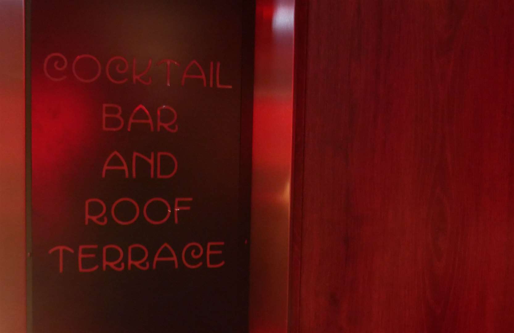 Sign to the cocktail bar and roof terrace