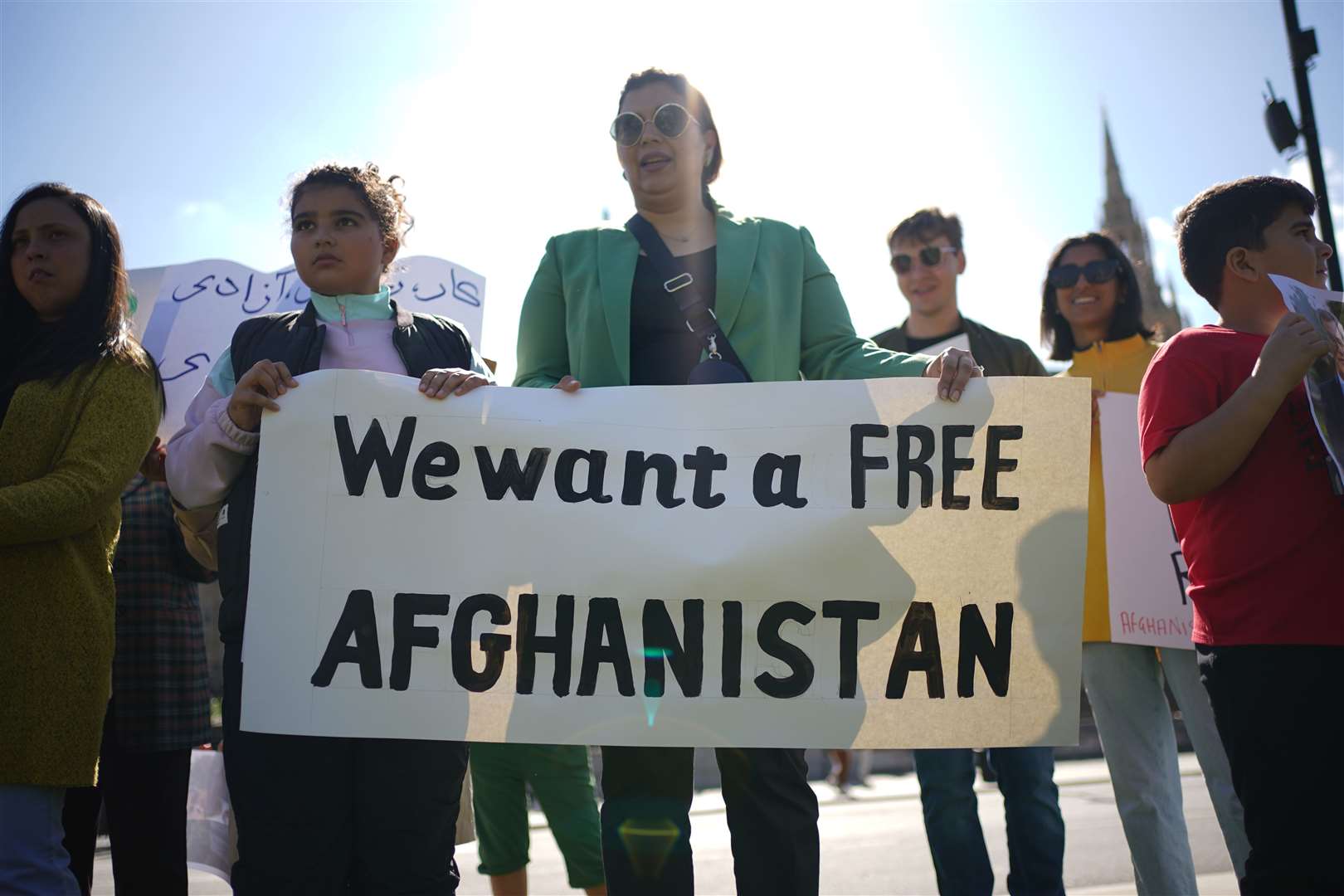 People protesting in Parliament Square in London on the anniversary of the Taliban takeover of Afghanistan (Yui Mok/PA)