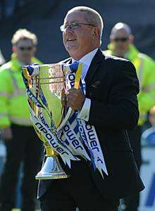 Gillingham chairman Paul Scally with the trophy after the club won the Leage 2 championship
