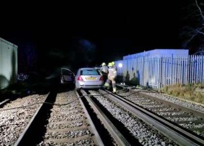 A car was abandoned on a train line near Stone Crossing station