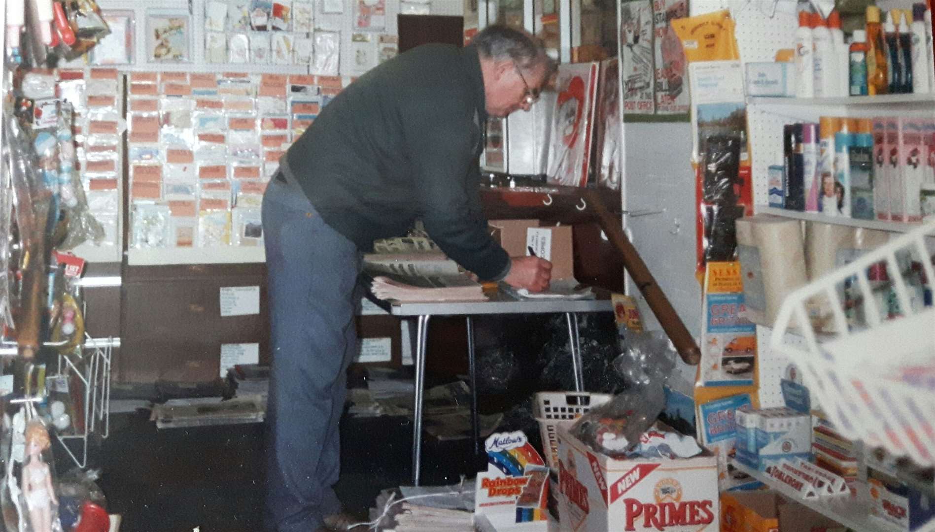 Don Esland in his shop marking up newspapers for delivery
