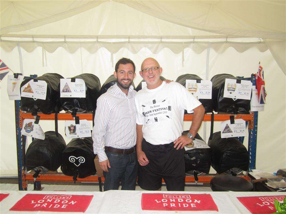 Mick Curtis of Drink Warehouse and landlord Renny Dobbs preparing for this year's beer festival