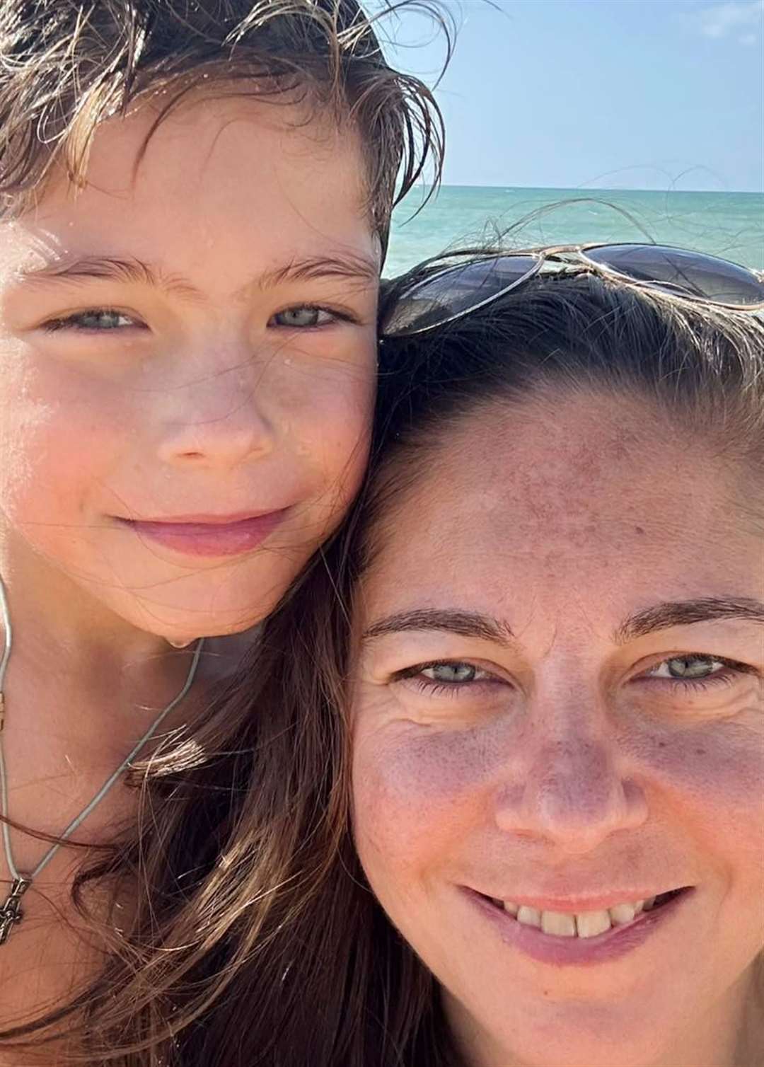 Jenka Levytska-Swinyard with her eight-year-old son, Theodore, who she says was almost hit by a scooter on the pavement