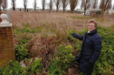Cllr Pat Sandle shows the land adjacent to Leysdown village hall on which it is proposed to build five homes