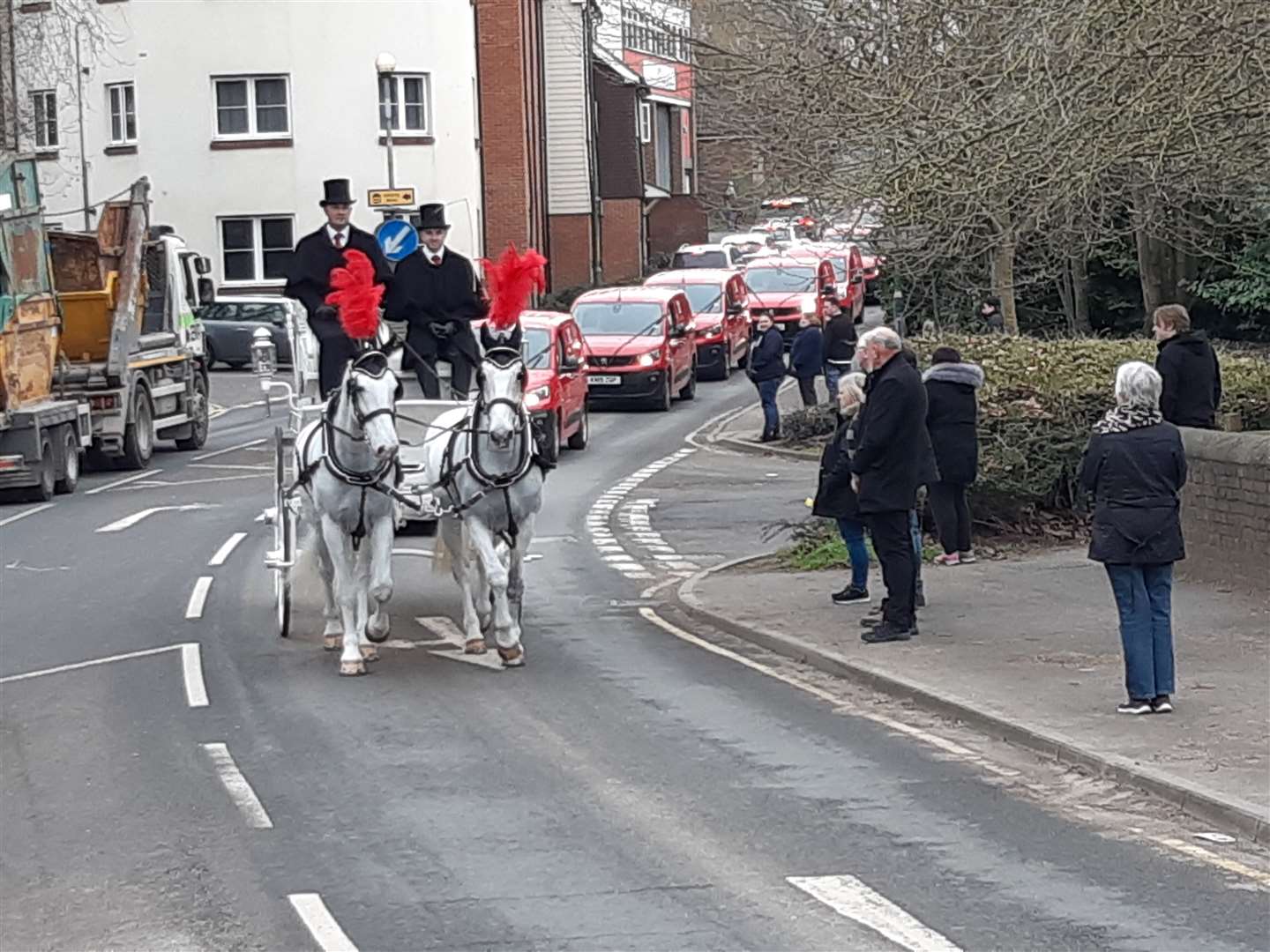 A horse-drawn carriage and Royal Mail vans drove through Maidstone for Paul Dunmill's funeral