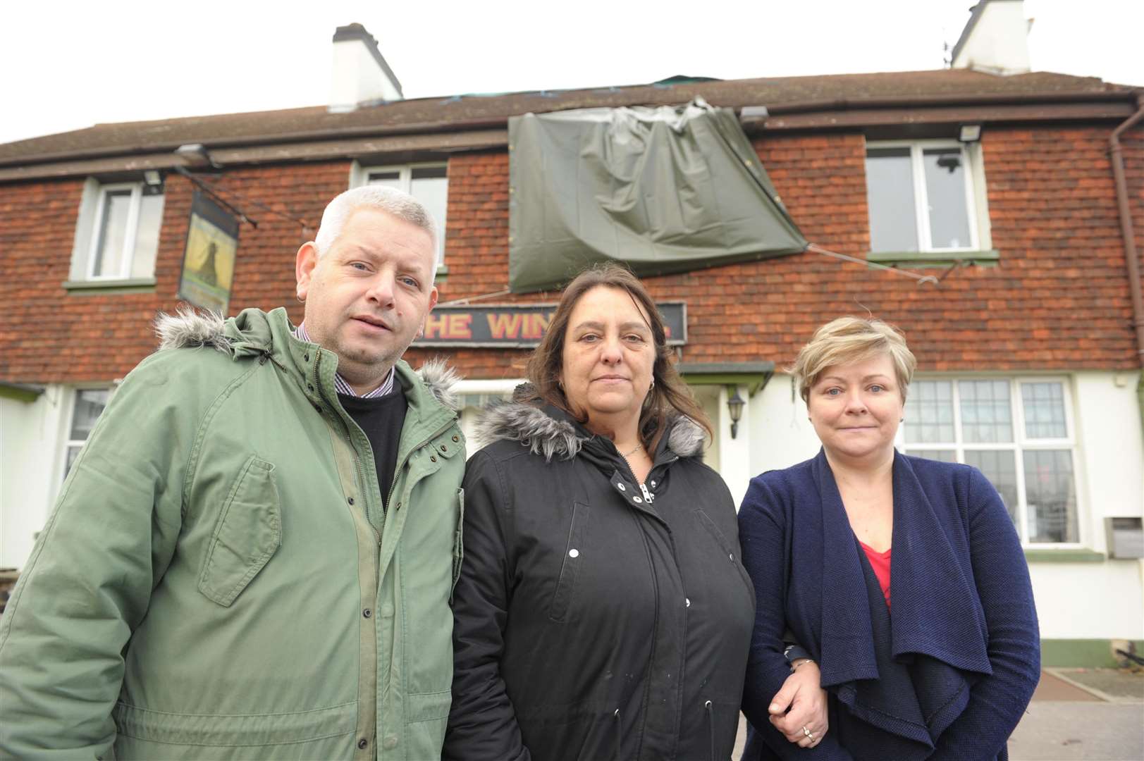 Andy and Madaline Scoffield with bar manager, Lana Woodard outside the Windmill pub