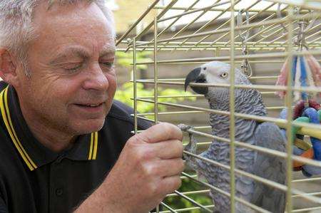 Michael Sargison, with whistling parrot Rodney.