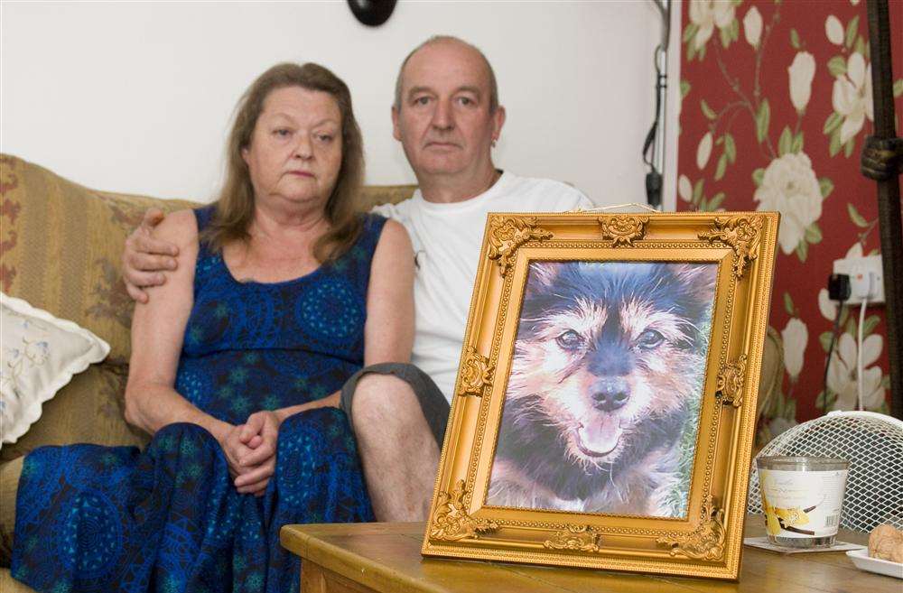 Steven Cuzner and his wife Susan with photo of their dog Snoop who had to be put to sleep after it was attacked by another dog