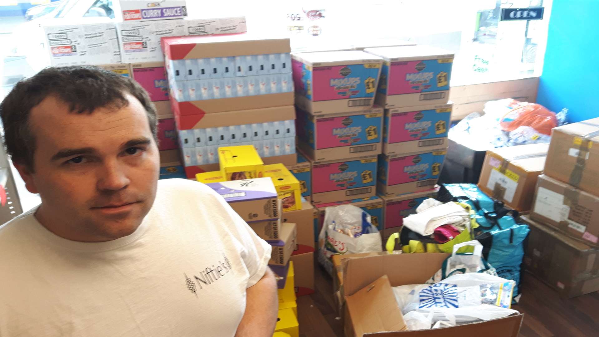 Nathaniel Richards with some of the supplies for survivors of the Grenfell disaster