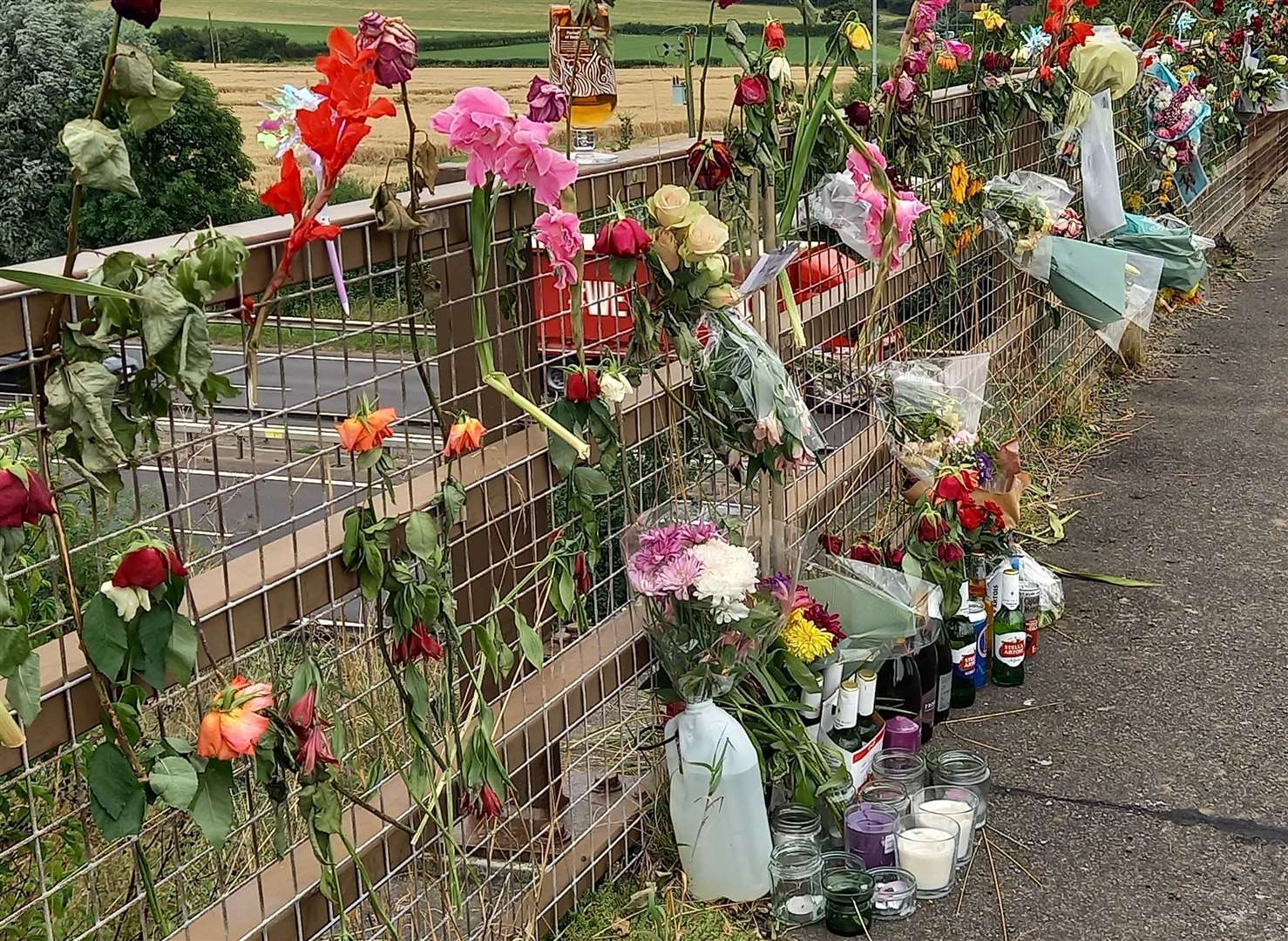 Floral tributes were left on the bridge where Lee Harlow died