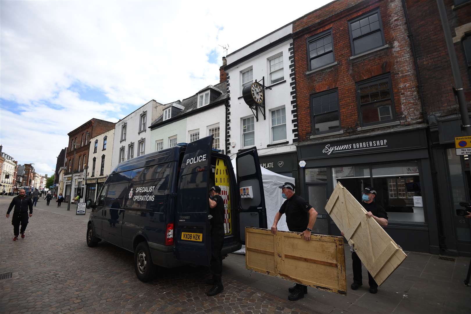 Wooden doors were carried out of the property on Tuesday morning (Joe Giddens/PA)