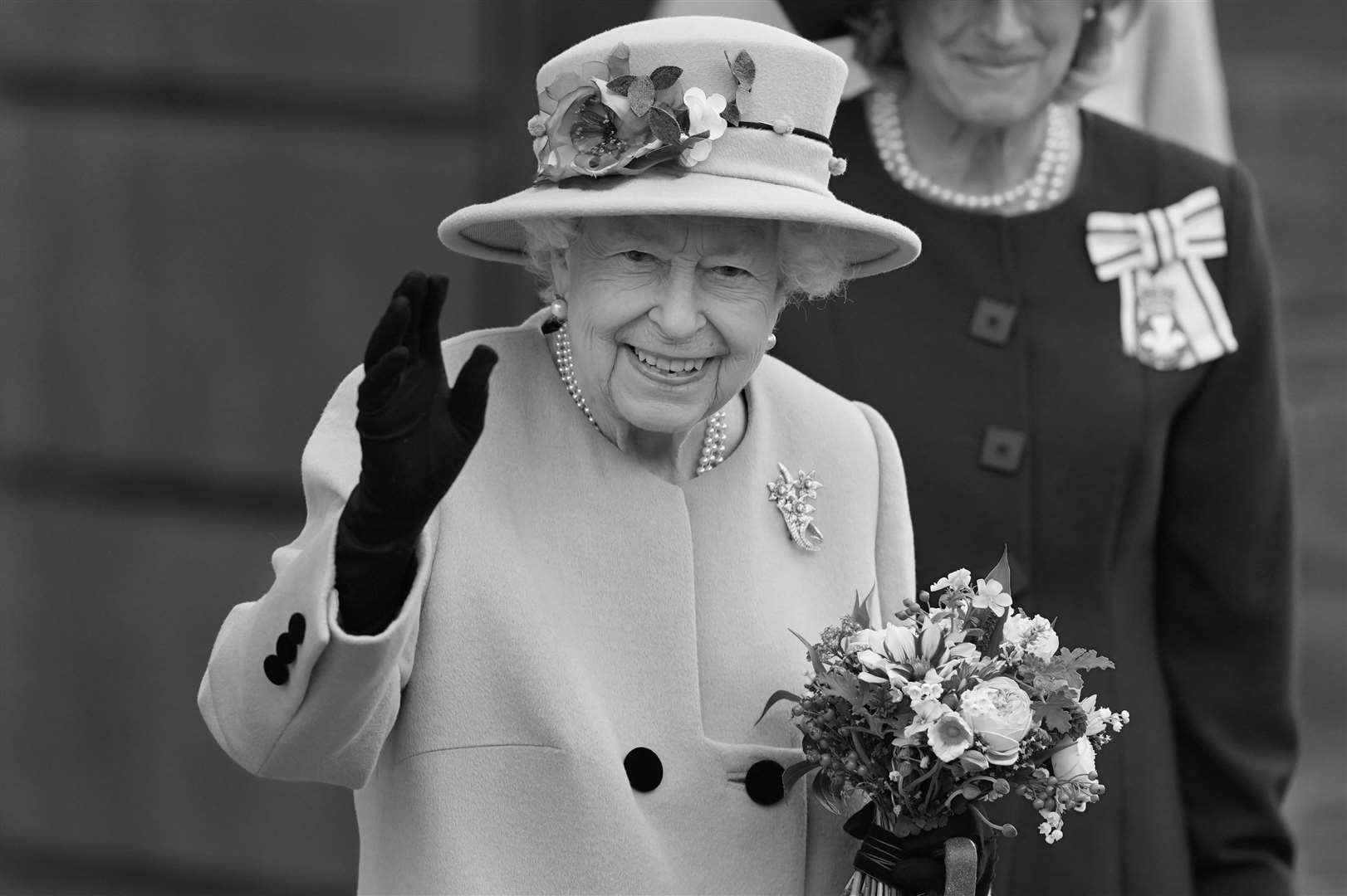Queen Elizabeth II leaves after attending the opening ceremony of the sixth session of the Senedd in Cardiff in October last year