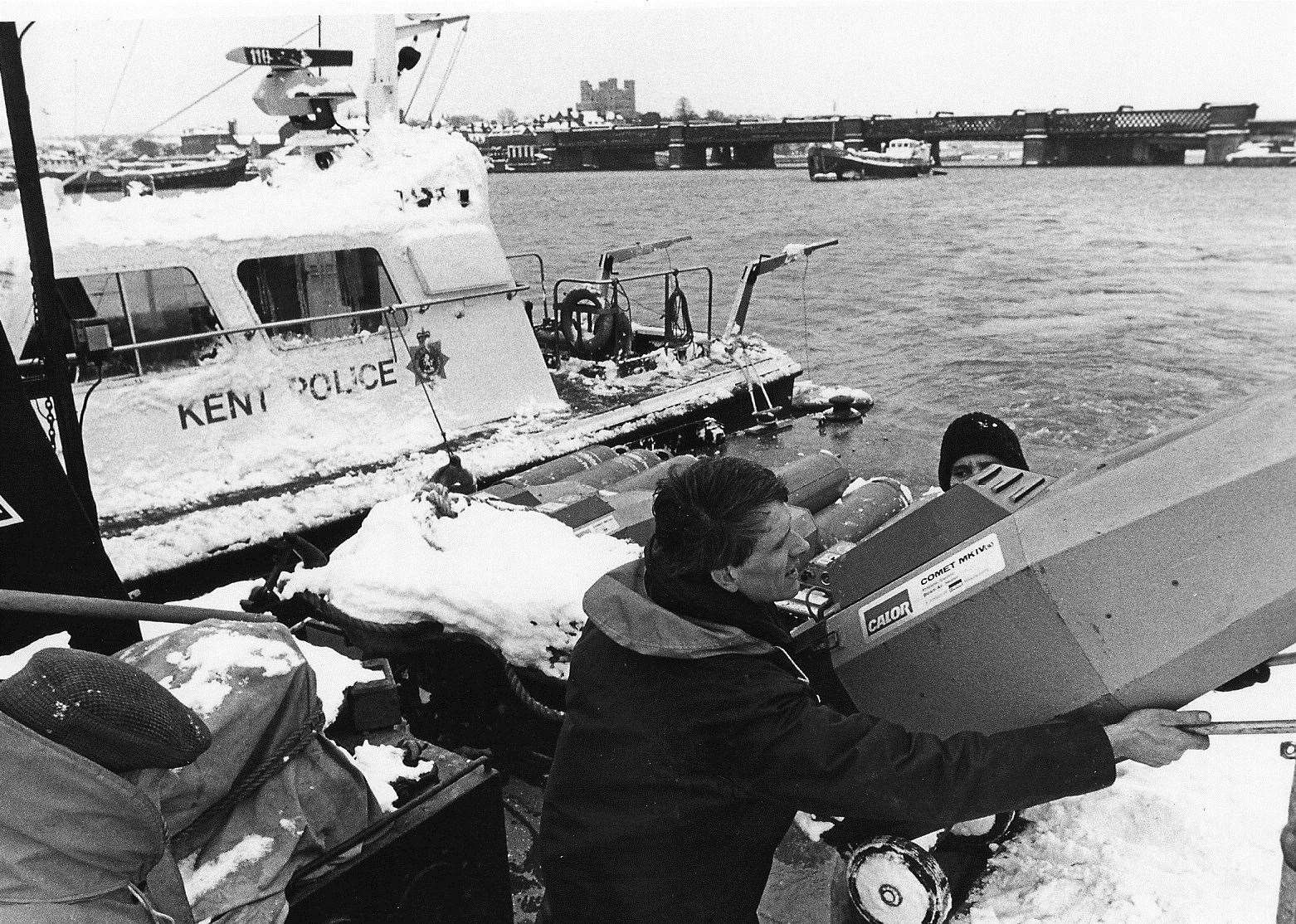 The Isle of Grain was cut off and the only means of access was by water. Here, a police boat is loaded with a portable gas heater for the Kent Oil Refinery which was desperately in need of warmth to stop essential equipment from freezing solid. Picture: Brian Weeden