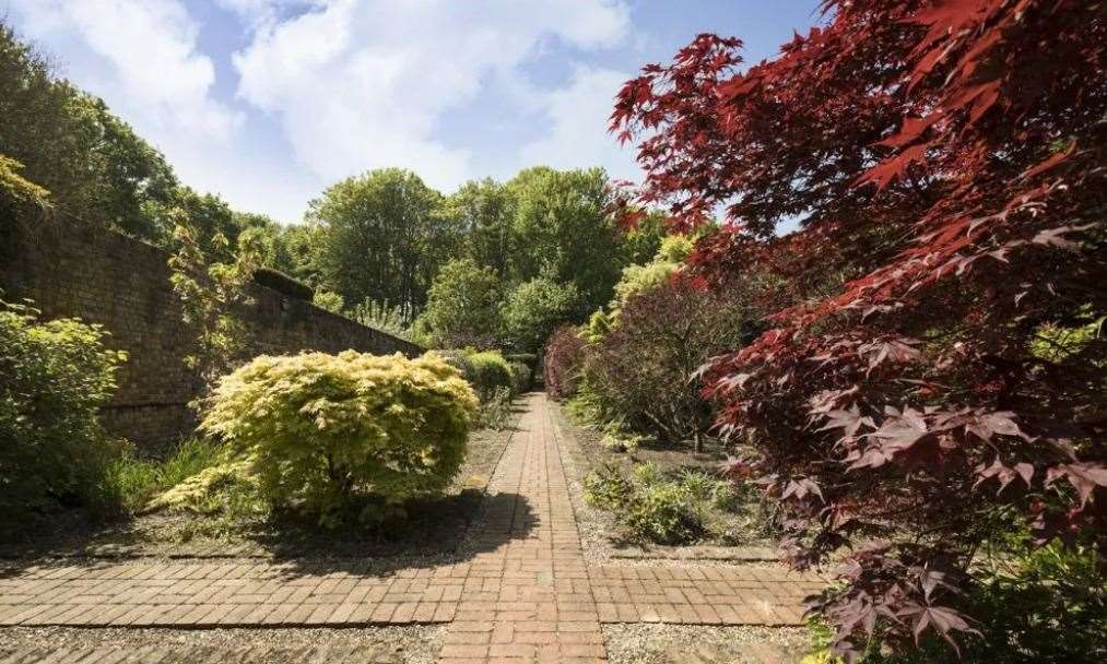 The formal gardens at Oxney Court Picture: UK Sotheby's International Realty - Cobham