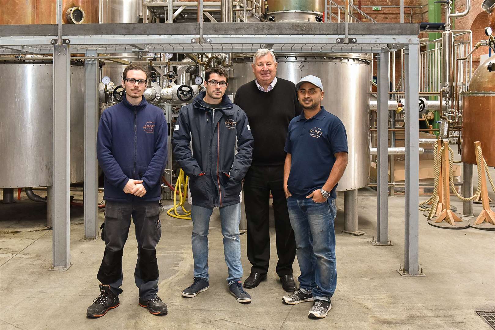 Bob Russell, one of the co-founders of Copper Rivet Distillery, Chatham Maritime with distillery workers Abhi Banik, Sergio Penades and Harrison Lambert. Picture: Tony Jones.