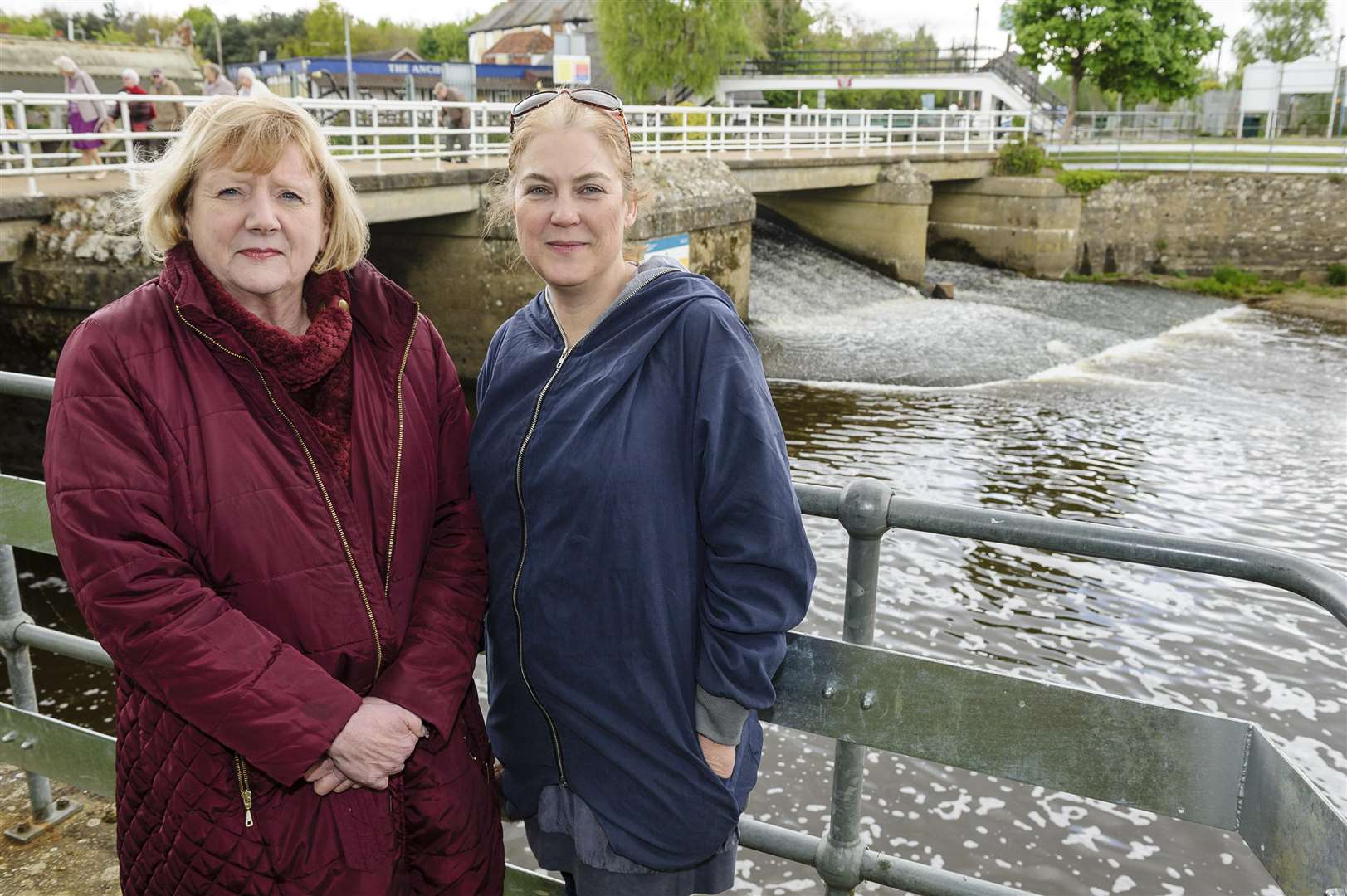 Geraldine Brown, council chairman, left, and Angela Gent, parish clerk at the weir. Both are warning of the dangers of getting in the water