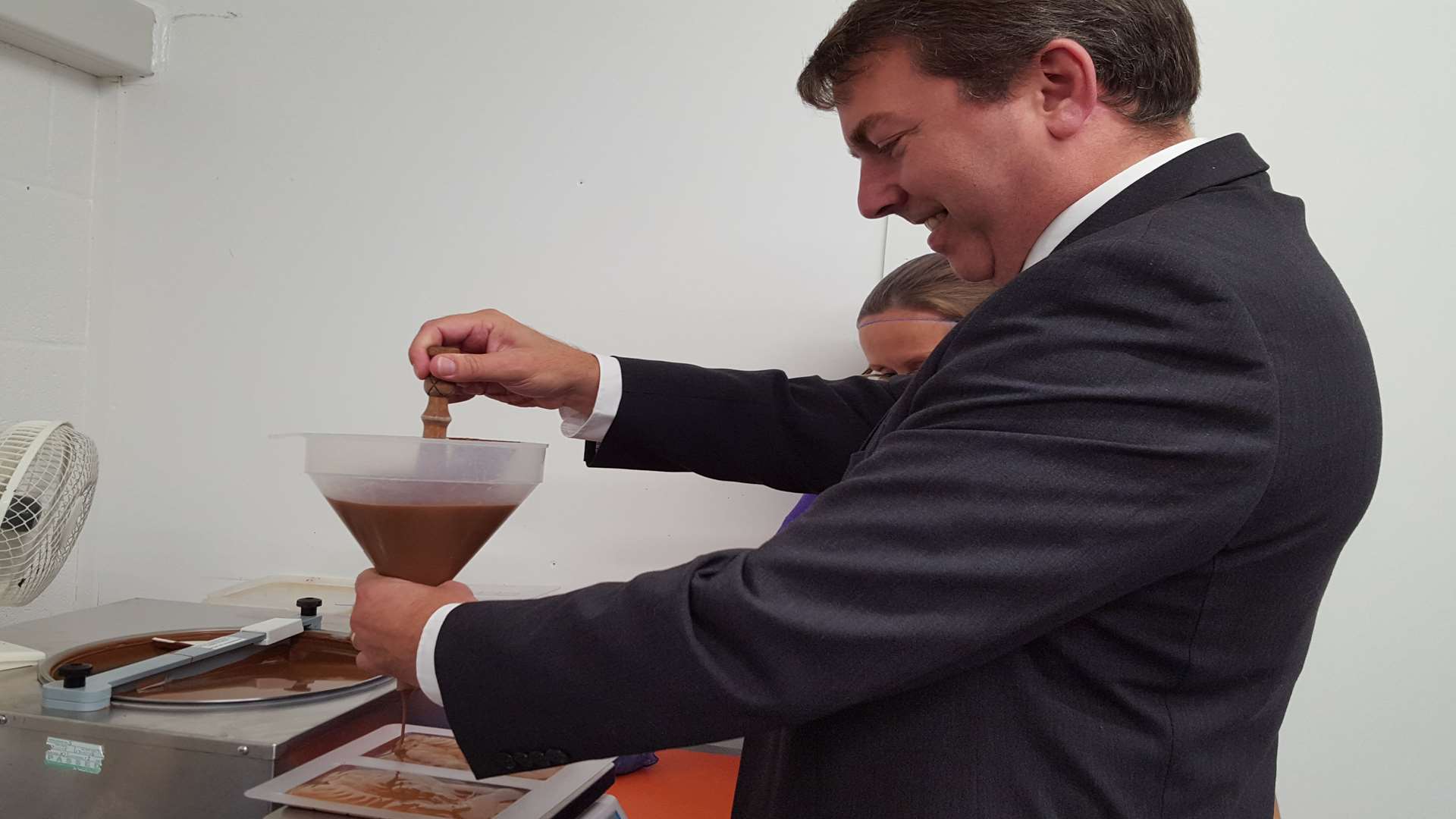 Dartford MP Gareth Johnson has a go at chocolate making