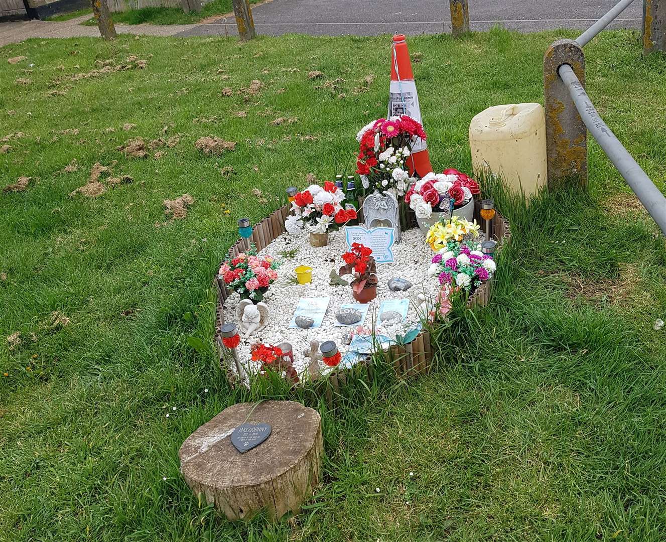 A memorial to Jamie Simmons who was stabbed outside his home
