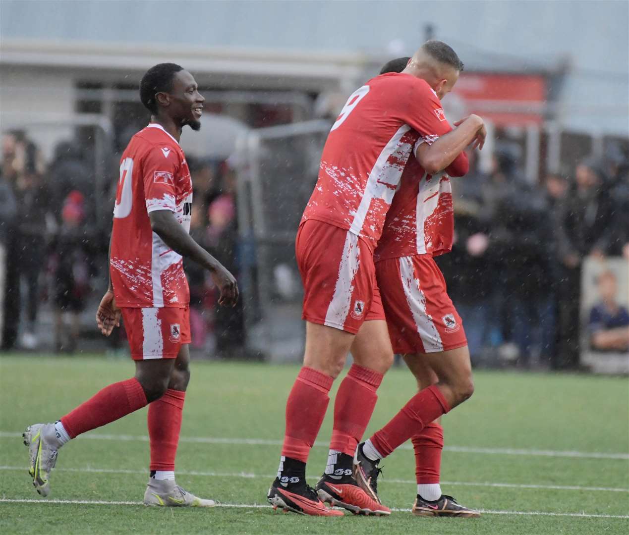 TJ Jadama is congratulated by Joe Taylor (No.9) and Jordan Green after scoring Ramsgate’s equaliser against Woking. Picture: Barry Goodwin
