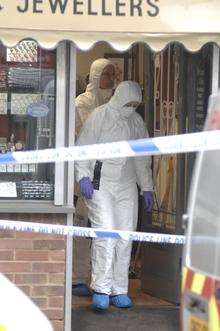 Forensic officers at Battrum & Son Jewellers in Sittingbourne High Street