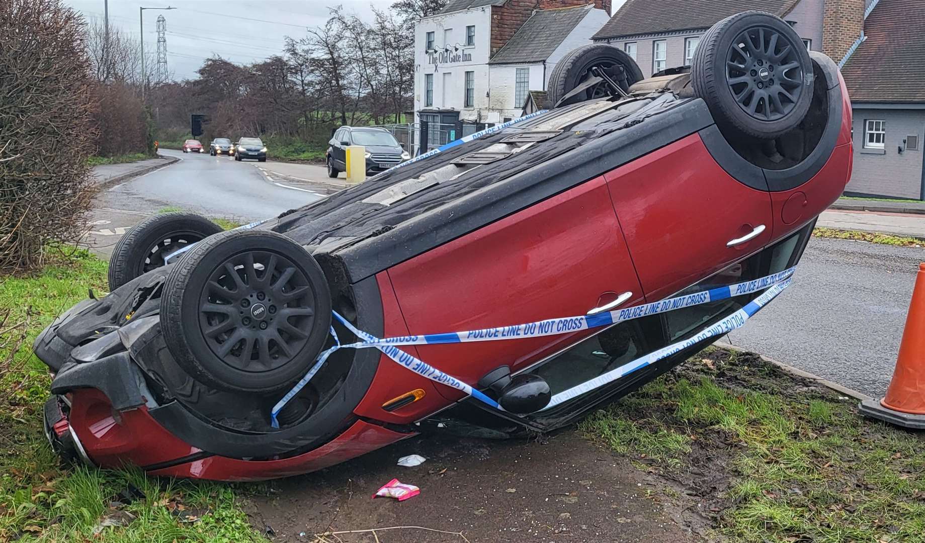 A red Mini Cooper crashed at the roundabout near the Old Gate Inn in New Dover Road, Canterbury