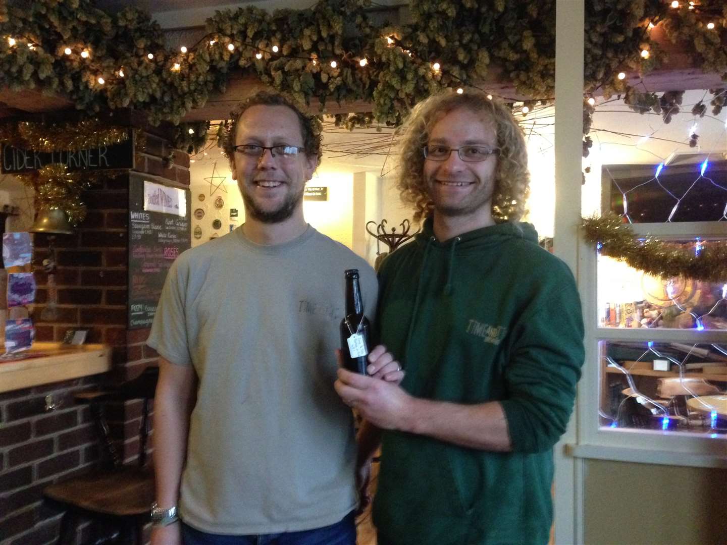 Chris Barnes of the Berry pub has had a beer named after him - Barnes on Fire, by Time & Tide brewery. Pictured with head brewer Sam Weller (right)
