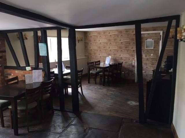 At the back of the pub there’s a large dining room, complete with a newly decorated wall – Charlie says the wine case façade was added while they were closed