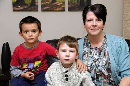 Harry Evans, four, centre, and his friend Devan Crawford, five, with Harry’s mum Sharon Evans