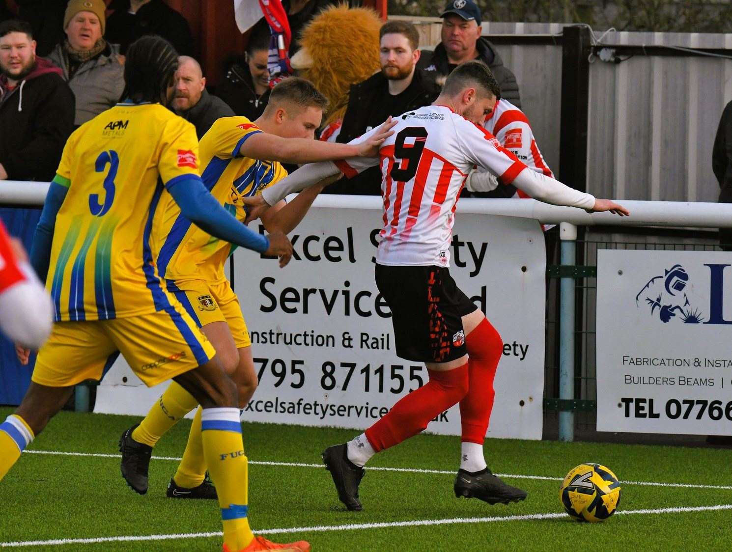 Sittingbourne defender Joe Tyrie keeps tabs on Sheppey’s Dan Bradshaw during a Boxing Day 3-3 draw. Picture: Marc Richards