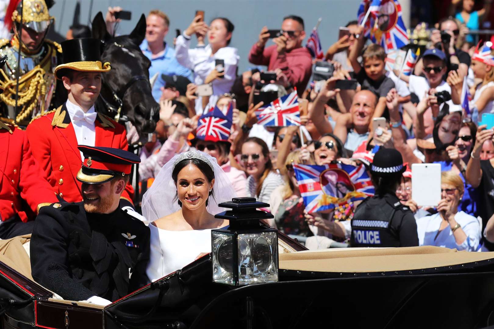 The Sussexes ride through Windsor in an Ascot Landau carriage after their wedding (Christopher Furlong/PA)