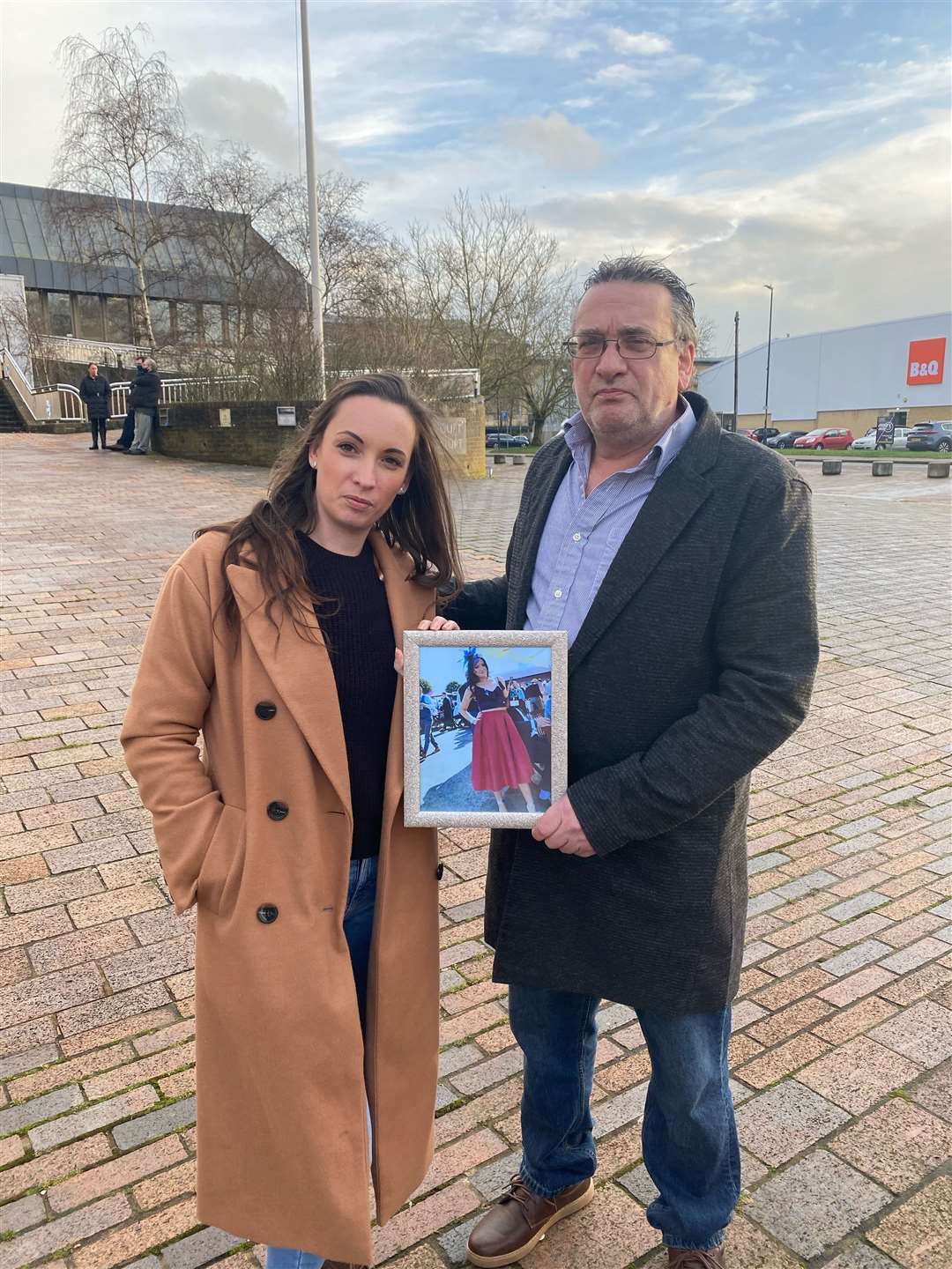 Gemma Robinson's sister Kirsty Robinson and her dad Tony Robinson with a photo of her outside Maidstone Crown Court following Falconer's sentencing in February which they said was not justice for Gemma