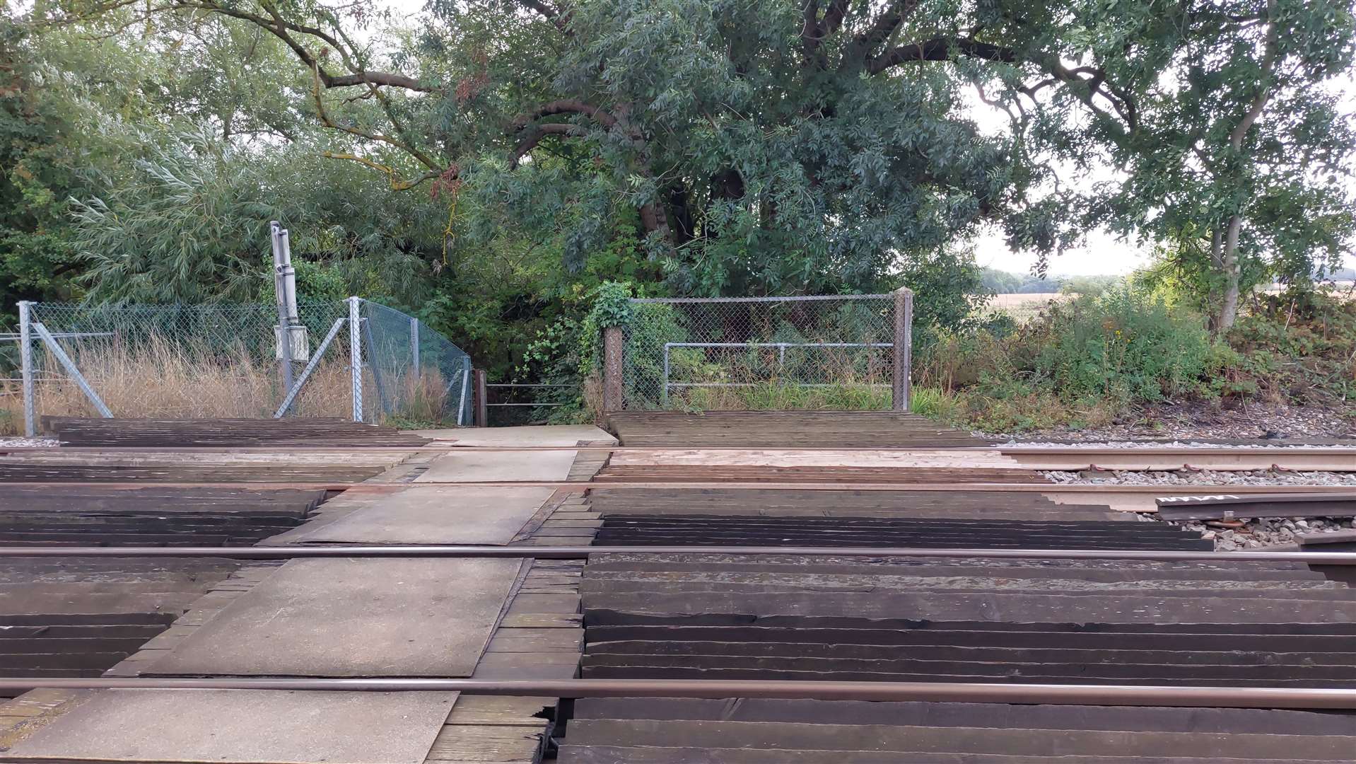 The current Cradle Bridge level crossing, which is a gate over the rail line