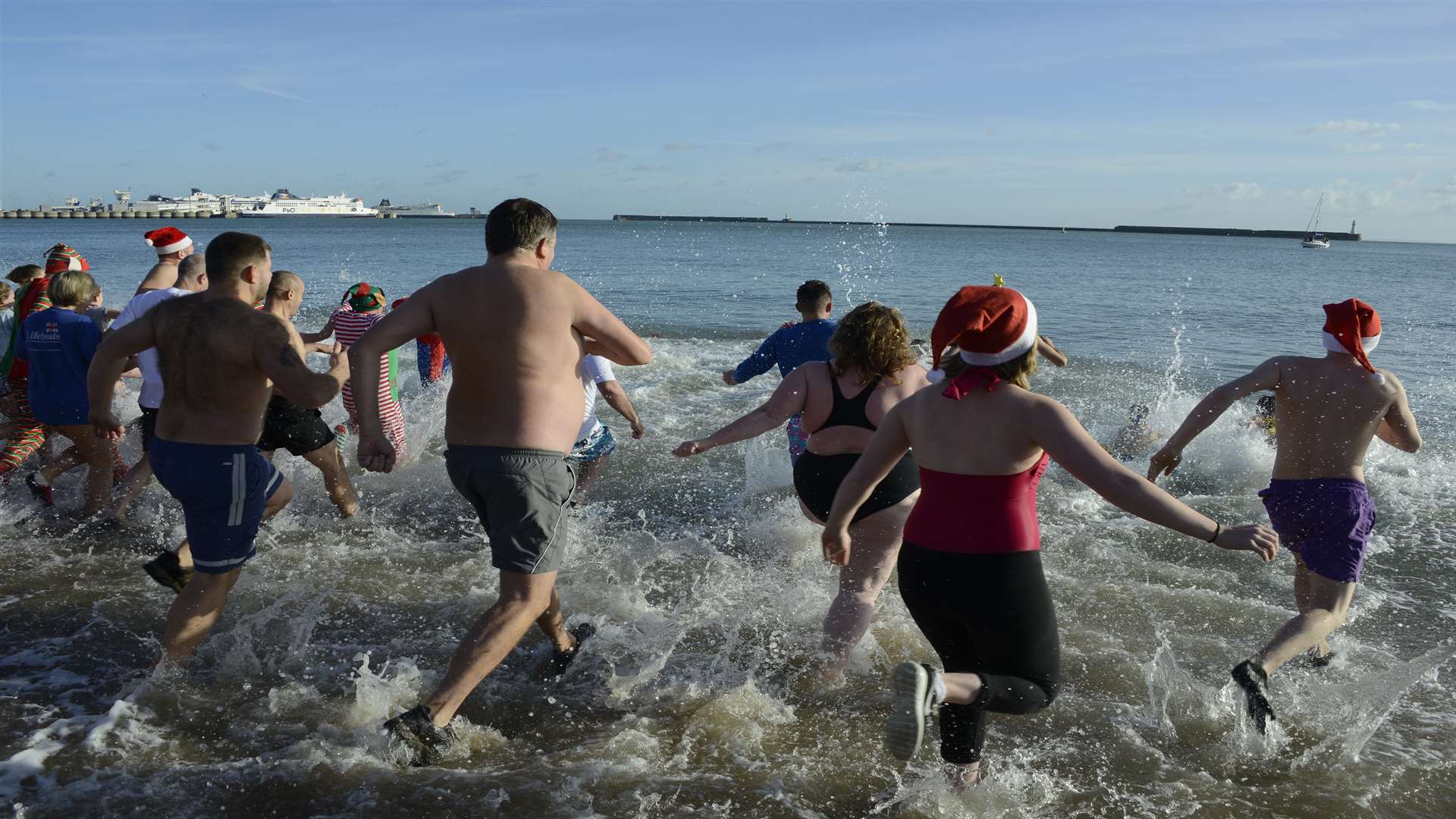 Bathers charge into the water for the Dover Boxing Day Dip.