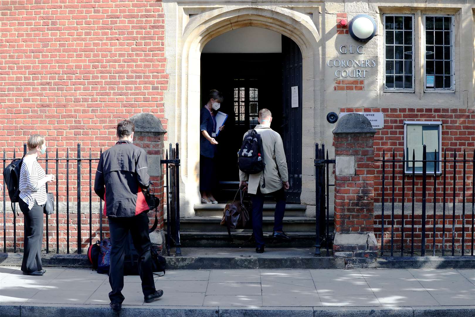A queue develops outside Poplar Coroner’s Court prior to the resumption of the inquest (Jonathan Brady/PA)