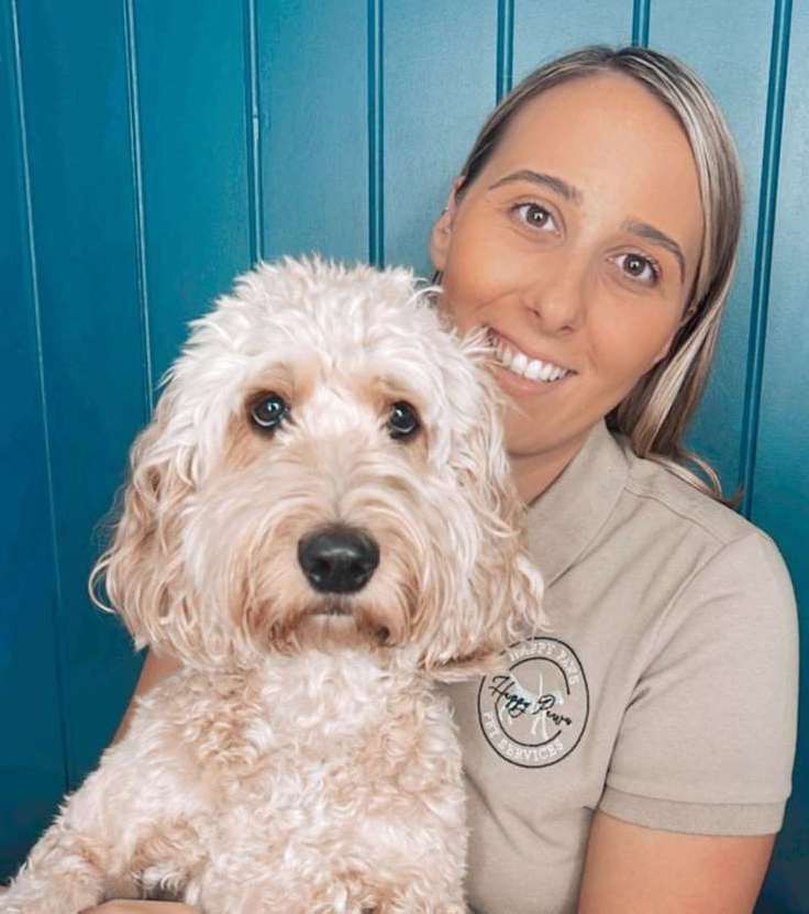 Happy Paws Pet Services owner Tuesday Charlton and her own cockapoo, Daisy. Picture: Tuesday Charlton