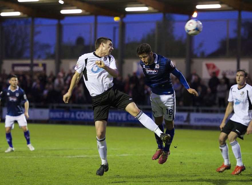 Max Cornhill gets to the ball ahead of Andi Thanoj Picture: Andy Payton