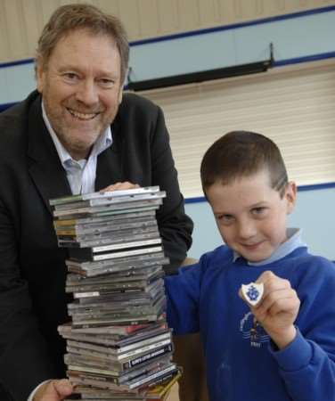One of the most recent badge winners: Jed Pearson, nine, with his Blue Peter badge for collecting over 600 CDs for the school appeal