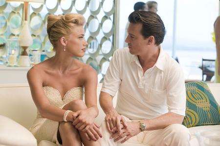 Amber Heard, left, and Johnny Depp in The Rum Diary. Picture: PA Photo/Organic Marketing