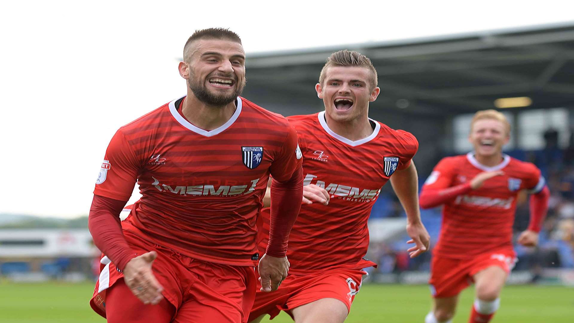 Gillingham defender Max Ehmer celebrates the winner at Shrewsbury Picture: Barry Goodwin