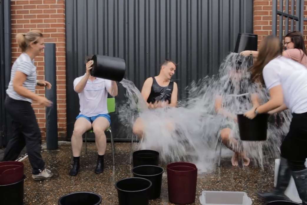 Members of staff threw unlimited buckets of iced water over the directors for a donation of £3