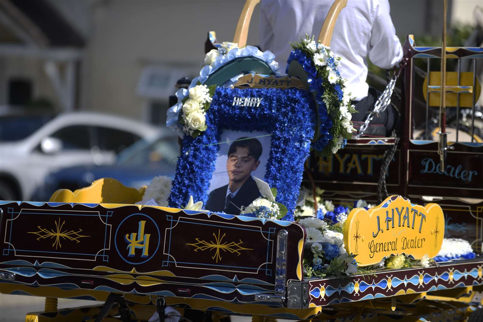 The procession included dozen of floral tributes