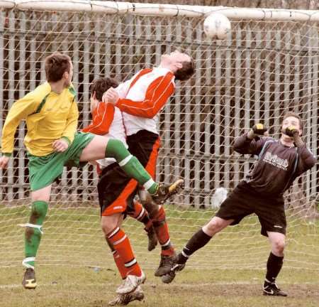 Real Gima and Old Comrades battle it out in the Gravesend and Dartford Messenger Cup on Sunday