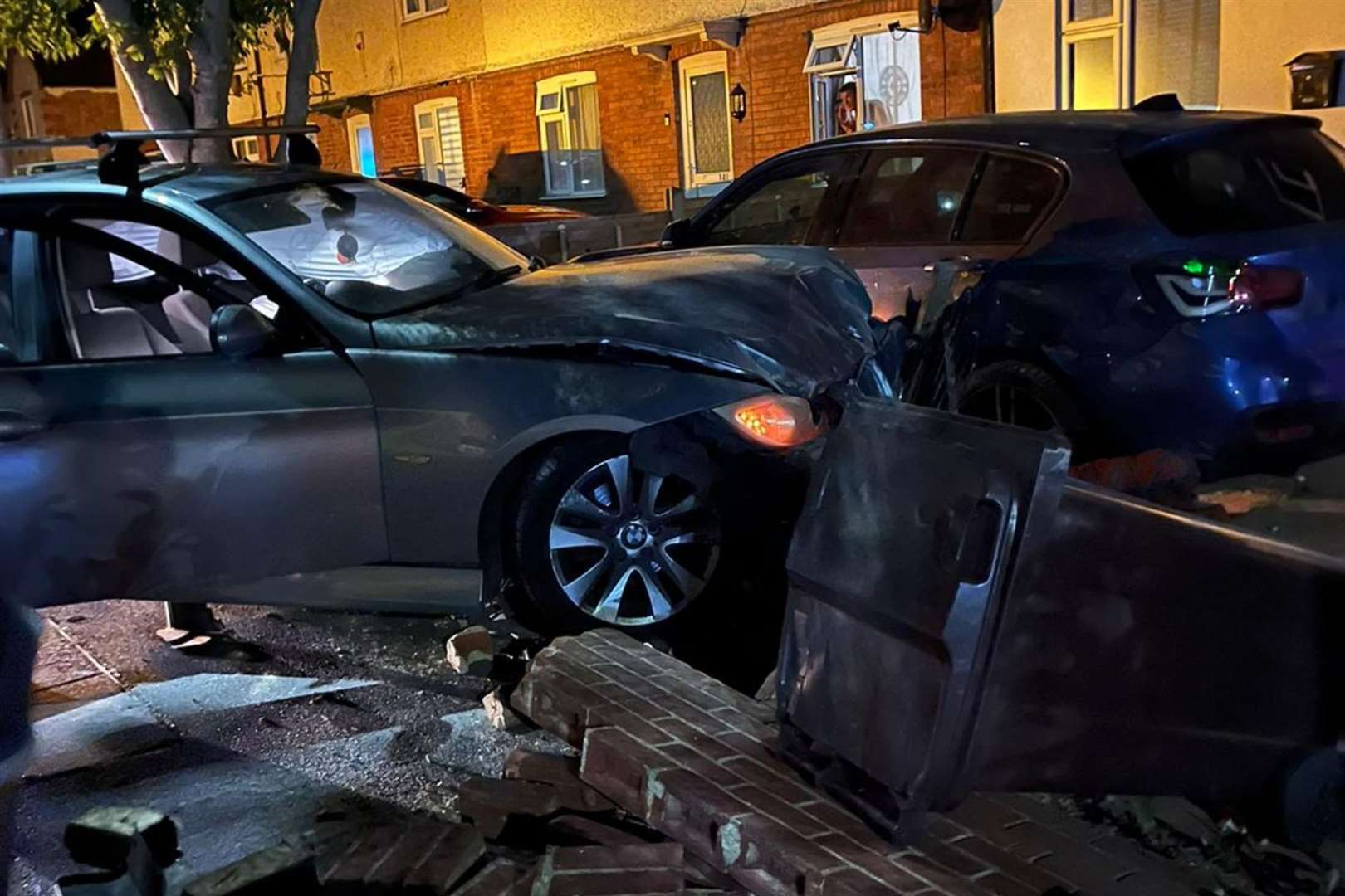 A silver BMW crashed through a wall and into a car on Saturday. Picture: Skye Edmond