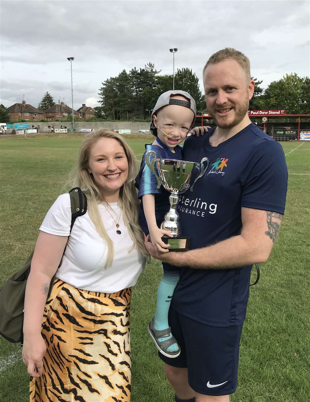 Archie with his parents Simon and Harriet Wilks following a fundraising football match in Saffron Walden, Essex, in 2019 (Beverley Rouse/PA)