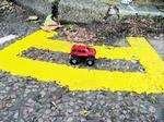 A toy car demonstrates how short these yellow lines are