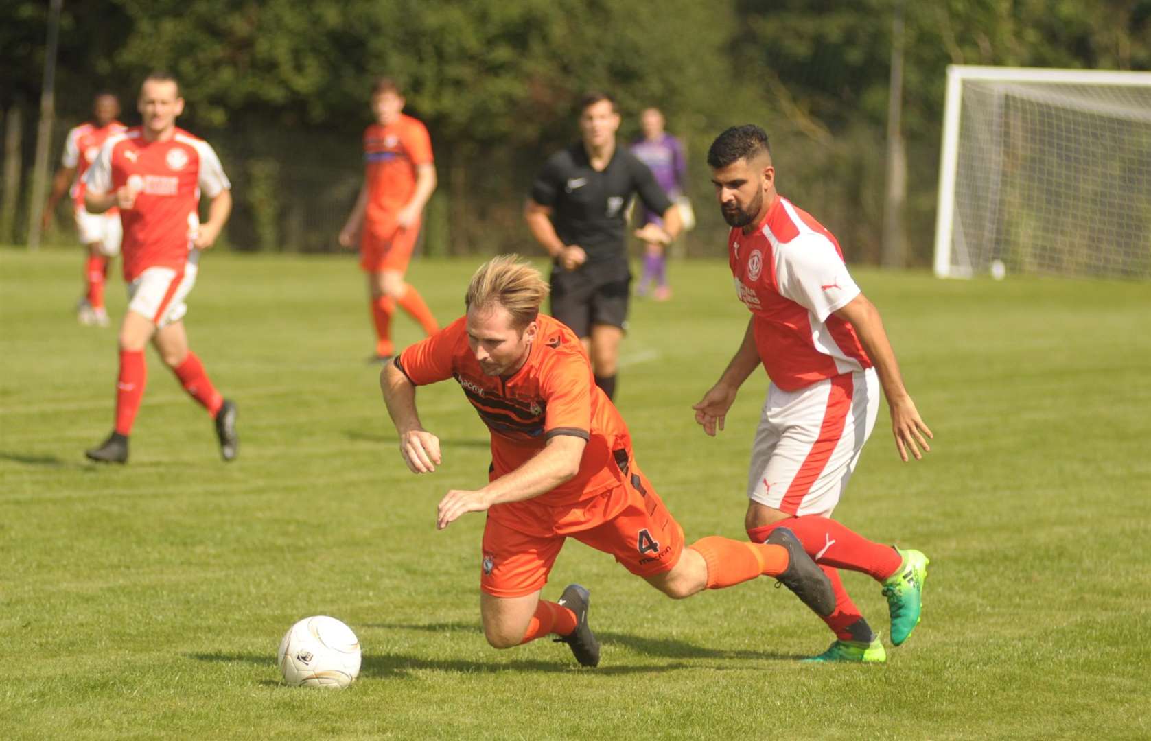 Action from the 2-2 draw between Lordswood (orange) and Punjab (red) Picture: Steve Crispe
