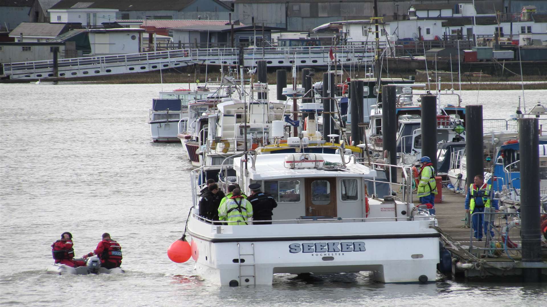 Police officers and the coastguard searched the river. Picture: Becky Langridge.