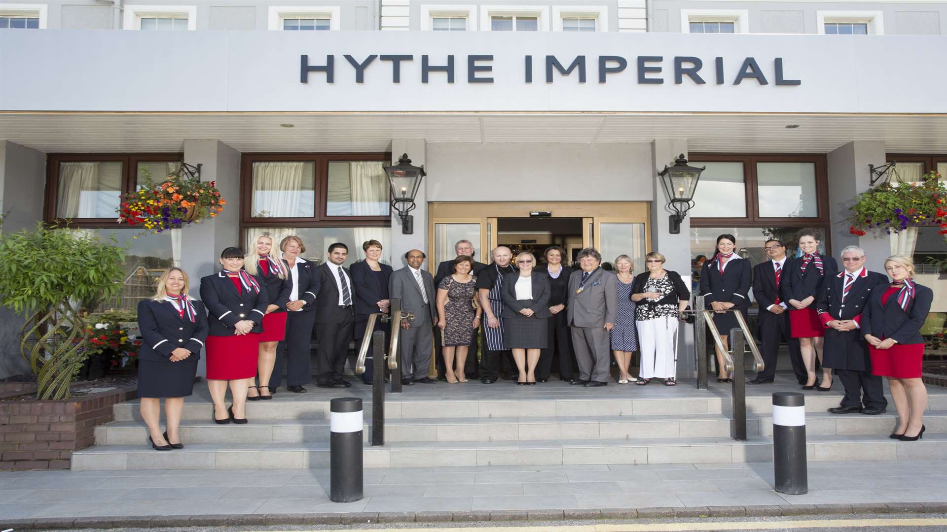 Len Louis, chief executive of Classic British Hotels, and Michael Lyons, the Mayor of Hythe, join staff of the Hythe Imperial at the launch event