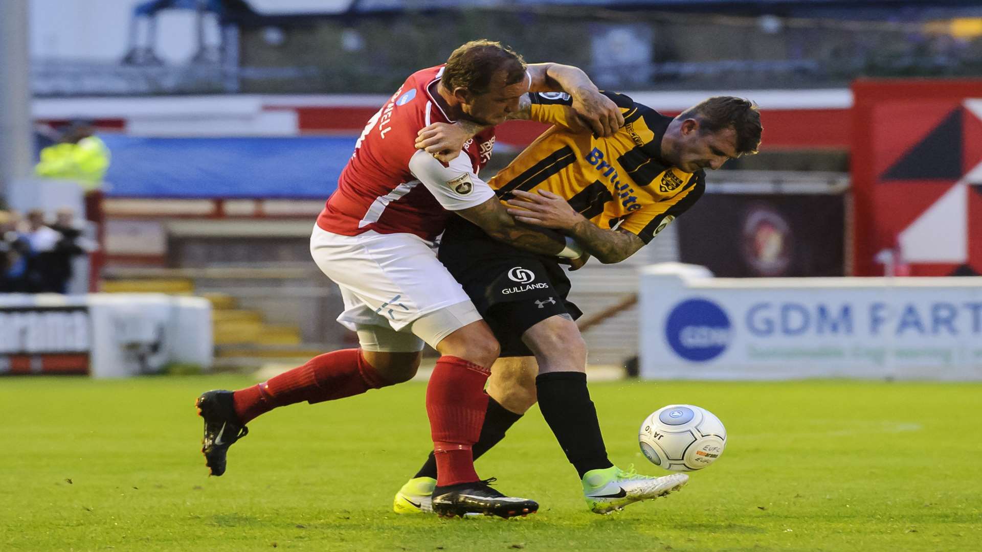 Danny Kedwell gets to grips with Reece Prestedge Picture: Andy Payton